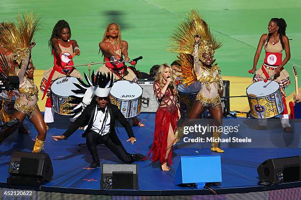 Musicians Carlinhos Brown and Shakira perform during the closing ceremony prior to the 2014 FIFA World Cup Brazil Final match between Germany and...