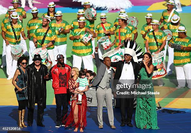 Carlos Santana, Wyclef Jean, Shakira with her son Milan Pique, Alexandre Pires, Carlinhos Brown and Ivete Sangalo look on during the Opening Ceremony...