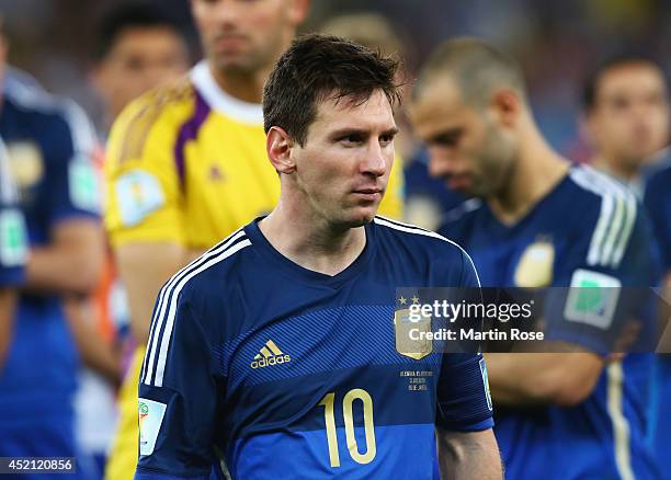 Dejected Lionel Messi of Argentina looks on after defeat during the 2014 FIFA World Cup Brazil Final match between Germany and Argentina at Maracana...