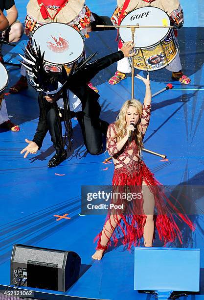 Musicians Carlinhos Brown and Shakira perform during the closing ceremony prior to the 2014 FIFA World Cup Brazil Final match between Germany and...