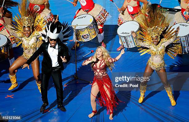 Musicians Carlinhos Brown and Shakira perform during the closing ceremony prior to the 2014 FIFA World Cup Brazil Final match between Germany and...