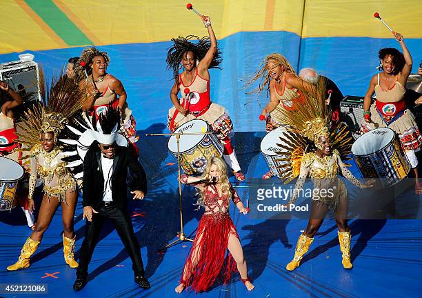 Musicians Carlinhos Brown and Shakira perform during the closing ceremony prior to the 2014 FIFA World Cup Brazil Final match between Germany and...