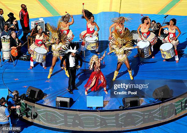 Musicians Carlinhos Brown and Shakira perform during the closing ceremony prior to the 2014 FIFA World Cup Brazil Final match between Germany and...