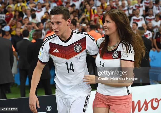 Julian Draxler of Germany and his girlfriend Lena celebrate Germany's victory after the 2014 FIFA World Cup Brazil Final match between Germany and...