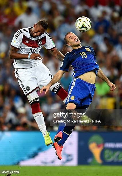 Jerome Boateng of Germany and Rodrigo Palacio of Argentina compete for the ball during the 2014 FIFA World Cup Brazil Final match between Germany and...