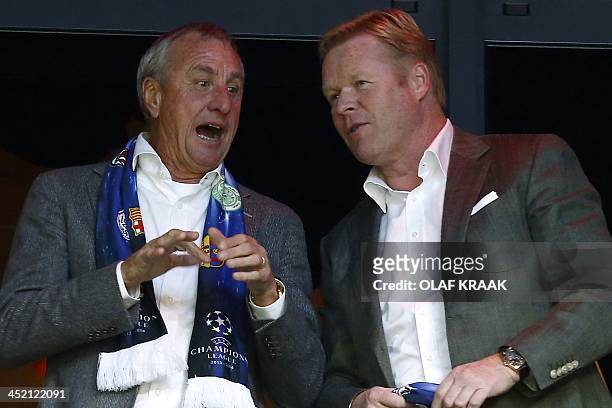 Dutch football legend Johan Cruijff and Feyenoord Rotterdam coach Ronald Koeman are pictured as they attend an UEFA Champions League group H football...