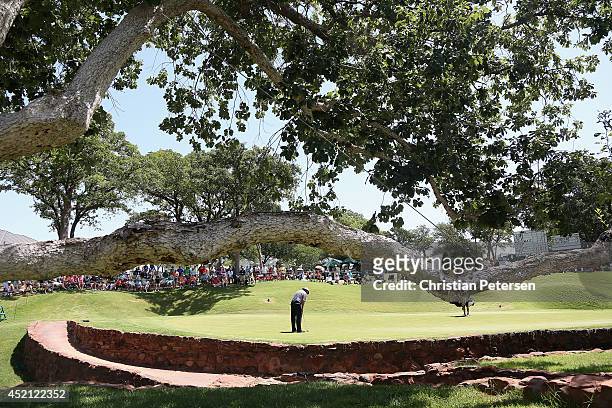 Kirk Triplett putts on the fourth green during the final round of the 2014 U.S. Senior Open Championship at Oak Tree National on July 13, 2014 in...