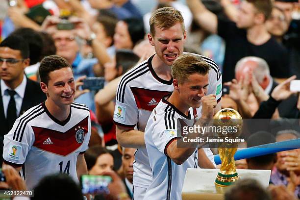 Erik Durm of Germany celebrates during the victory ceremony after defeating Argentina 1-0 in extra time in the 2014 FIFA World Cup Brazil Final match...