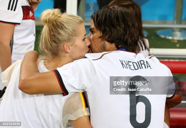 Sami Khedira of Germany and his girlfriend Lena Gercke celebrate the victory after the 2014 FIFA World Cup Brazil Final match between Germany and...