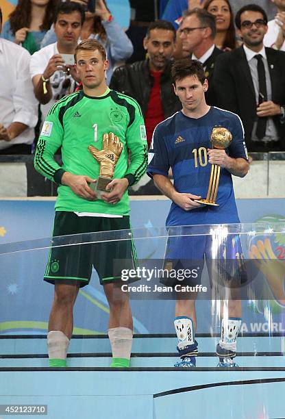 Goalkeeper of Germany Manuel Neuer and Lionel Messi of Argentina are honored as best goalkeeper and best player of the tournament after the 2014 FIFA...