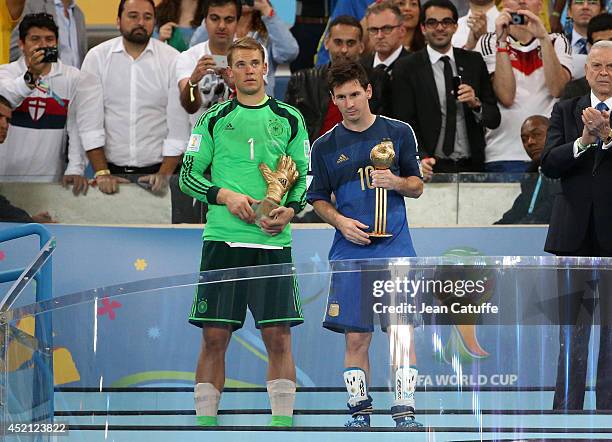 Goalkeeper of Germany Manuel Neuer and Lionel Messi of Argentina are honored as best goalkeeper and best player of the tournament after the 2014 FIFA...