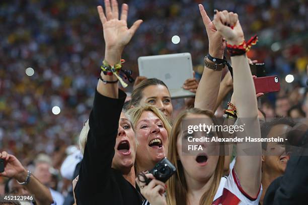 Birgit Koepke , Daniela Loew and Klara Szalantzy celebrate winning the World Cup after the 2014 FIFA World Cup Brazil Final match between Germany and...