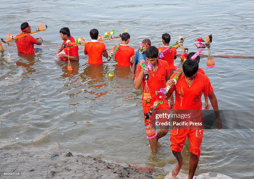 Hindu Devotees known as Kanwariya taking a holy dip in the...