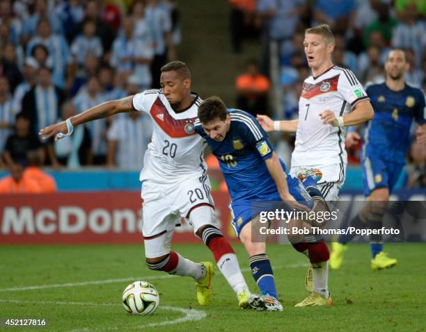 Lionel Messi of Argentina is tackled by Jerome Boateng of Germany during the 2014 FIFA World Cup Brazil Final match between Germany and Argentina at...