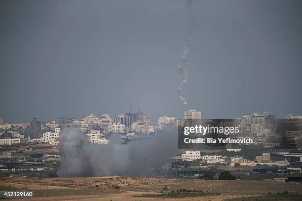 Smoke from an Israeli air strike rises over the Gaza Strip on July 14, 2014 at the Israeli-Gaza border. Israel's operation 'Protective Edge' has...