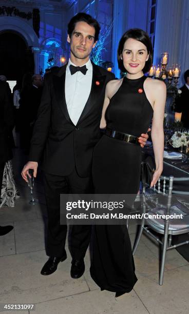 John Dineen and Michelle Dockery attend the Winter Whites Gala in aid of Centrepoint at Kensington Palace on November 26, 2013 in London, England.