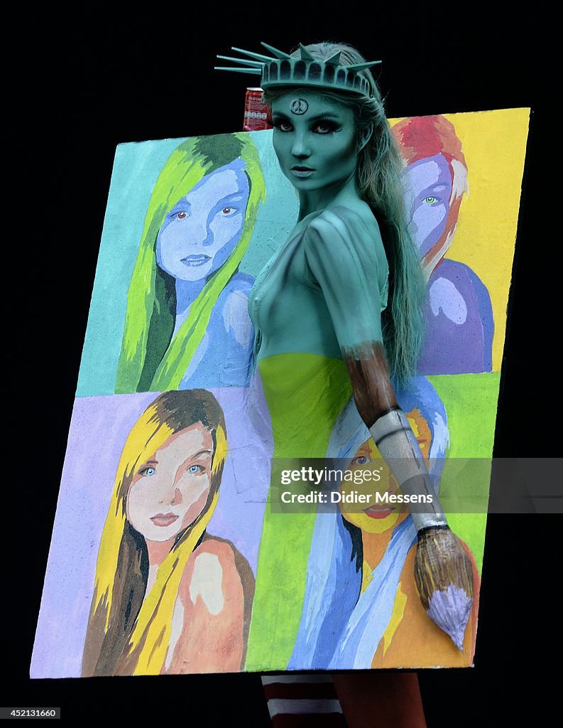 A participant poses with her body paintings designed by bodypainting ...