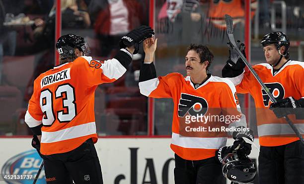 Jakub Voracek, Steve Downie and Jay Rosehill of the Philadelphia Flyers celebrate after defeating the Ottawa Senators 5-2 on November 19, 2013 at the...