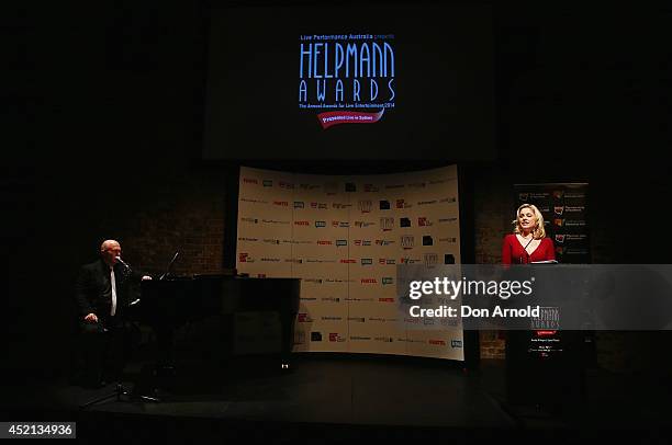 Phil Scott looks on as Helen Dallimore reads out award nominees during the Helpmann Awards Nomination Announcement at Sydney Theatre on July 14, 2014...
