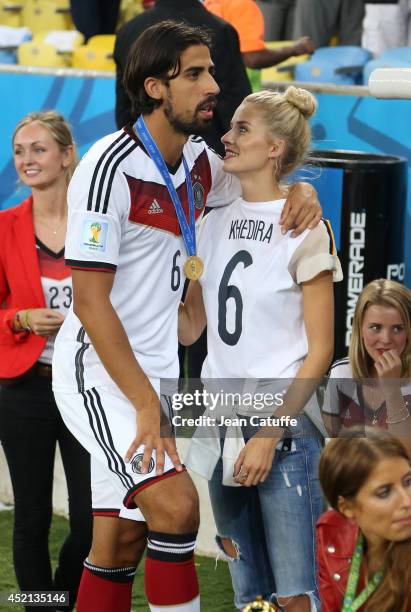 Sami Khedira of Germany and his girlfriend Lena Gercke celebrate the victory after the 2014 FIFA World Cup Brazil Final match between Germany and...