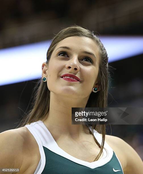 Members of the Michigan State Spartans dance team perform during the game against the Portland Pilots at the Breslin Center on November 18, 2013 in...