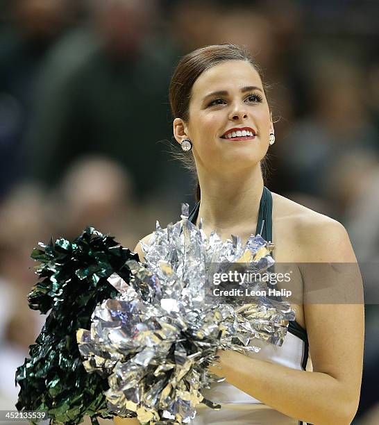 Members of the Michigan State Spartans dance team perform during the game against the Portland Pilots at the Breslin Center on November 18, 2013 in...