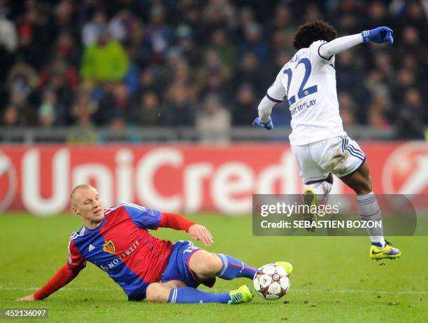 Chelsea's Brazilian midfielder Willian vies for the ball with Basel's Bulgarian defender Ivan Ivanov during the UEFA Champions League group E...