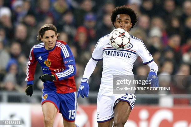 Chelsea's Brazilian midfielder Willian vies with FC Basel's defender Kay Voser during an UEFA Champions League group E football match FC Basel...