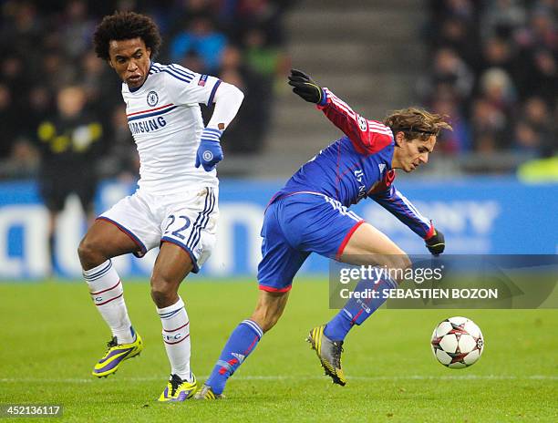 Chelsea's Brazilian midfielder Willian eyes the ball controlled by Basel's Swiss defender Kay Voser during the UEFA Champions League group E football...