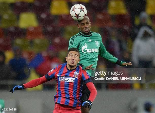 Bucharest's midfielder Gabriel Iancu and Schalke's Brazilian defender Felipe Santana vie for the ball during the UEFA Champions League Group E...