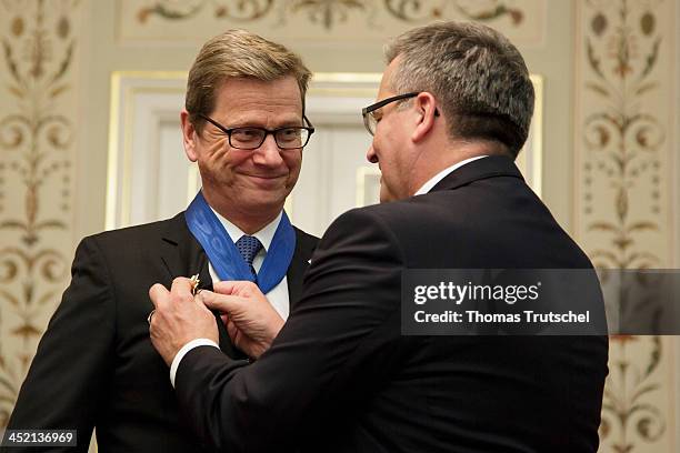 Polish president Bronislaw Komorowski awards German Foreign Minister Guido Westerwelle the Order of Merit of the Republic of Poland on November 26,...