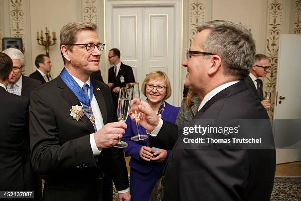 Polish president Bronislaw Komorowski awards German Foreign Minister Guido Westerwelle the Order of Merit of the Republic of Poland on November 26,...