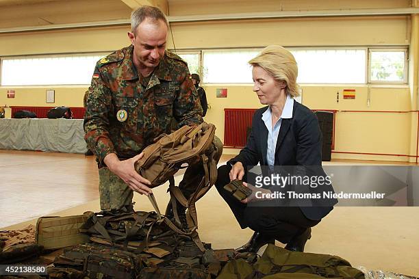 German Defense Minister Ursula von der Leyen talks to brigadier commander of KSK Dag Baehr during the elite KSK unit demonstrate their skills at a...