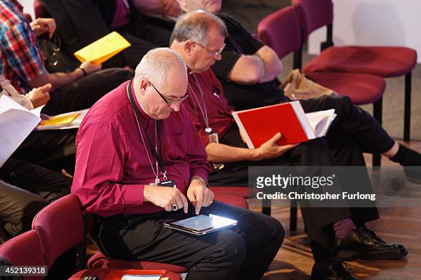 Members of the Church of England's Synod attend the morning session of the annual Church of England General Synod before they vote on the...