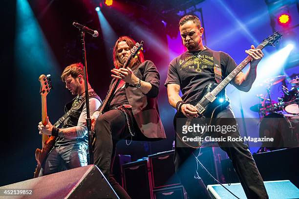 Brian Marshall, Myles Kennedy and Mark Tremonti of American rock group Alter Bridge performing live on stage at Wembley Arena in London, on October...