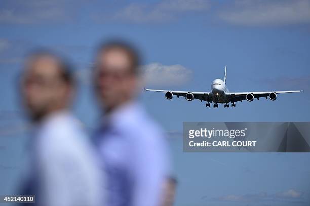 An Airbus A380-800 prepares to land during a flight demonstration at the Farnborough Airshow in Hampshire, southern England, on July 14, 2014....