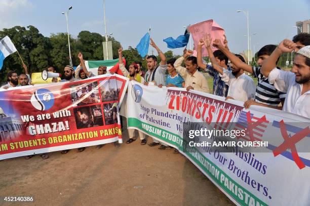 Activists of Muslim Students Organization Pakistan shout anti-Israeli and anti-US slogans during a demonstration against Israeli military operations...