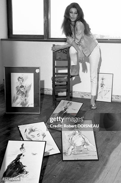 Famous french model Victoire Therond with sketches of Yves Saint Laurent in 1959.