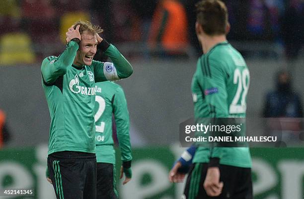 Schalke's defender Benedikt Hoewedes reacts at the end of the UEFA Champions League Group E football match FC Steaua Bucharest vs FC Schalke 04 in...