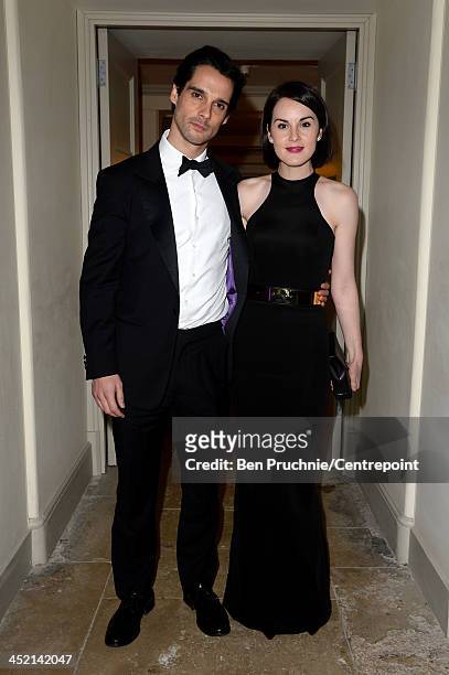 John Dineen and Michelle Dockery attend the Winter Whites Gala In Aid Of Centrepoint on November 26, 2013 in London, England.
