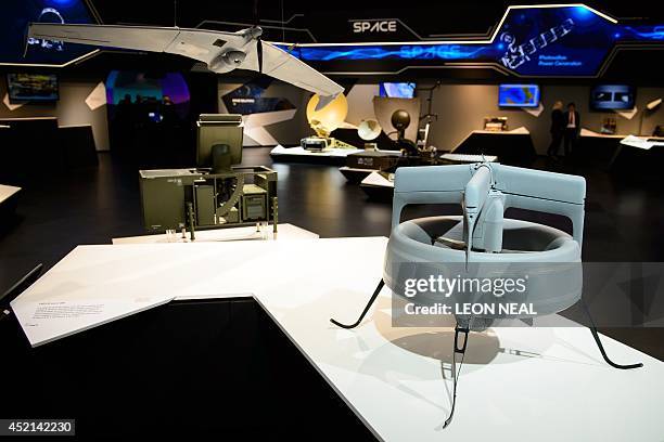 The CREX-B Micro UAV and the ASIO Vertical Take-Off and Landing mini UAV are shown in the Finmeccanica stand at the Farnborough air show in...