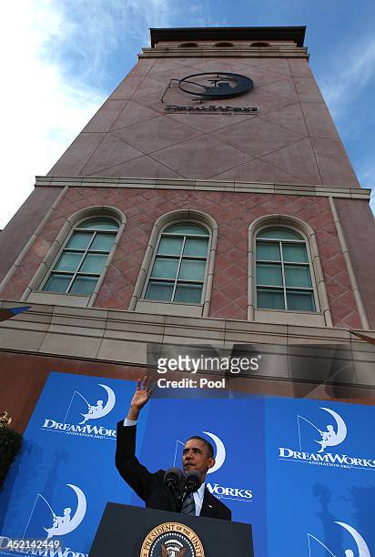 President Barack Obama waves to employees at DreamWorks Animation facility following his speech on November 26, 2013 in Glendale, California. The...