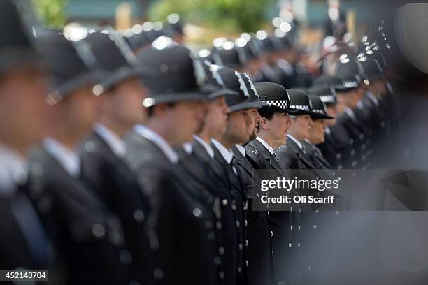 Police cadets who have completed their training take part in their 'Passing Out Parade' in the grounds of West Ham United Football Club on July 14,...