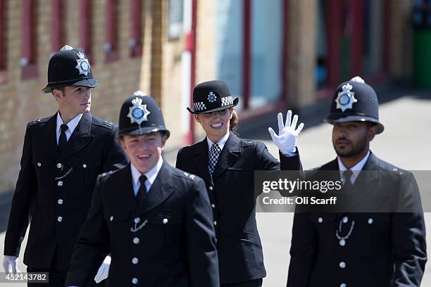 Police cadets who have completed their training prepare to take part in their 'Passing Out Parade' in the grounds of West Ham United Football Club on...