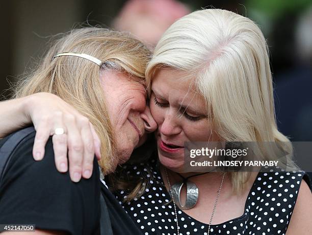 Doctor Elaine Storkey of Ely reacts as she leaves the venue after members voted to approve the creation of female bishops at the Church of England...