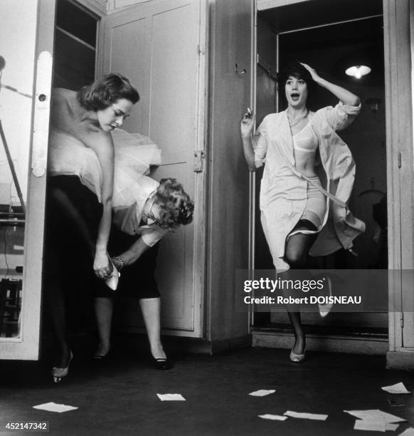 Lanvin dressing room, models getting ready backstage before a fashion show, 1958 in Paris, France.