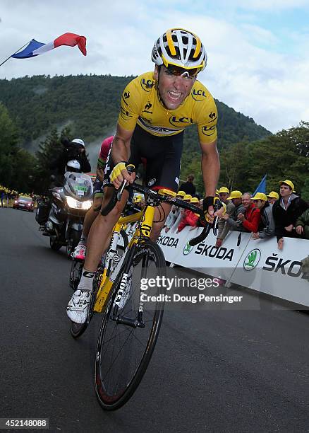 Tony Gallopin of France and Lotto Belisol makes the climb to the finish as he relinquished the overall race leader's yellow jersey to stage winner...