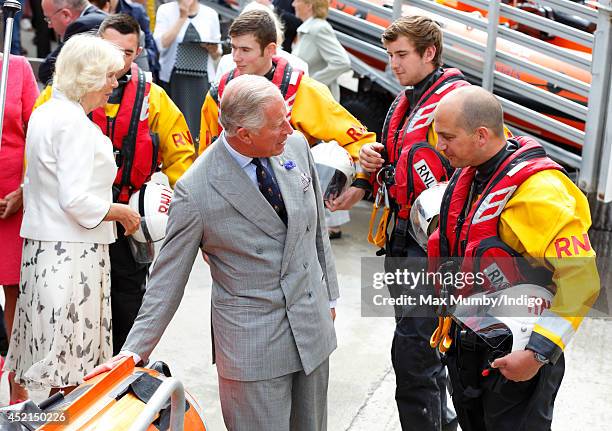 Prince Charles, Prince of Wales meets RNLI personnel on day one of his and Camilla, Duchess of Cornwall's annual visit to Devon and Cornwall on July...