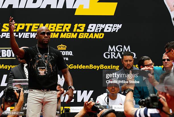 Floyd Mayweather Jr. Is introduced priro to the start of a news conference at the Pedestrian Walk in Times Square on July 14, 2014 in New York City....