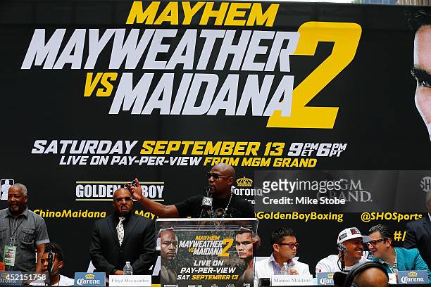 Floyd Mayweather Jr. Speaks to the media during a news conference at the Pedestrian Walk in Times Square on July 14, 2014 in New York City. Floyd...